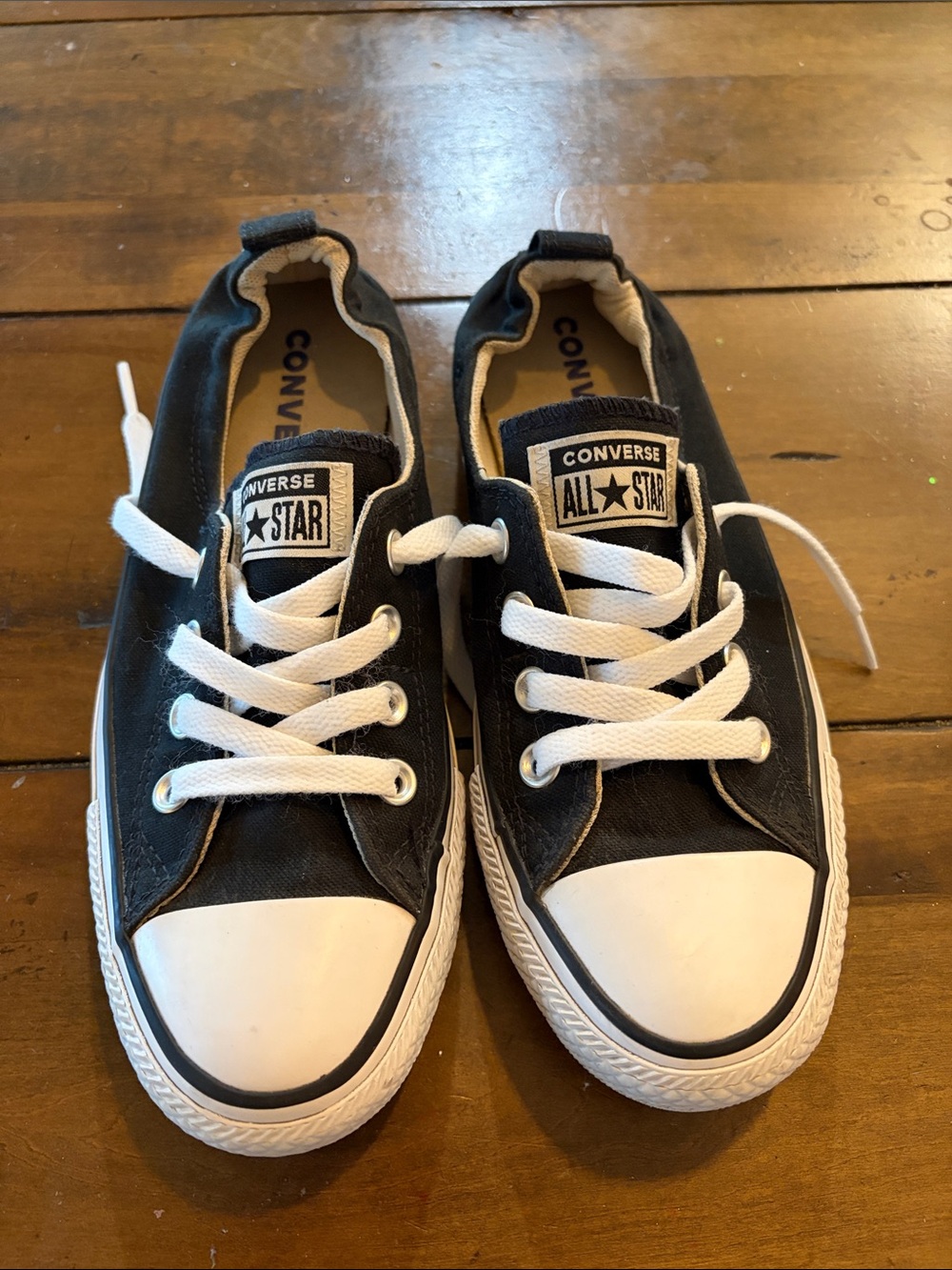 Converse Women’s Low-Top Sneakers in Black/White slip-ons